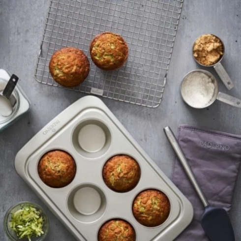 A muffin pan with freshly baked muffins.