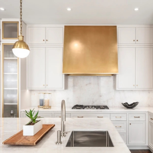 Hazelton Hotel private residence interior with all white kitchen and gold accents by Michael London Design