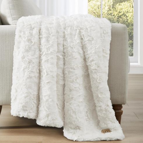 White buzzy throw blanket on white furniture