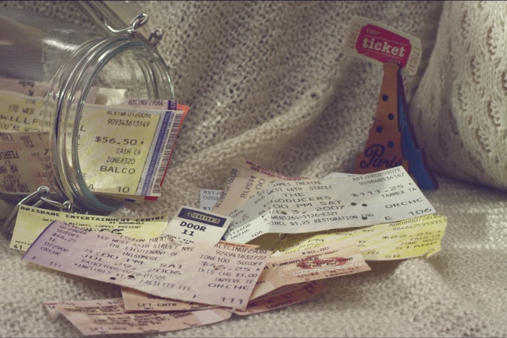 tickets pouring out of glass jar
