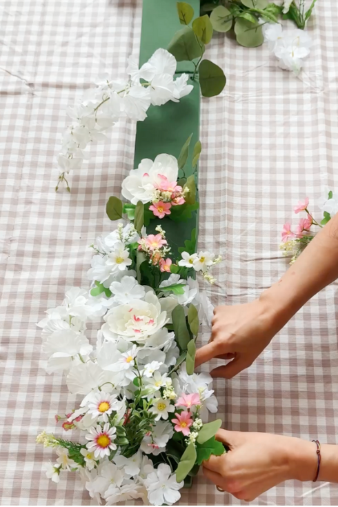 adding faux florals to a foam floral tablescape for easter