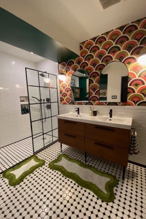 Green-painted bathroom with wallpaper