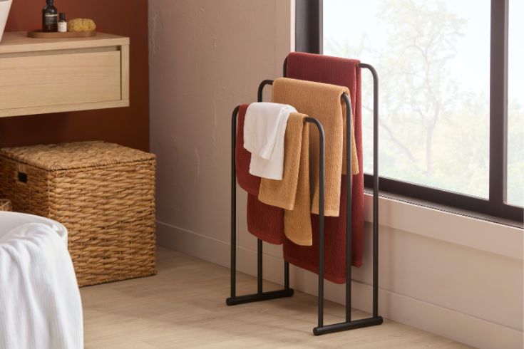 Towel rack in earthy-toned bathroom