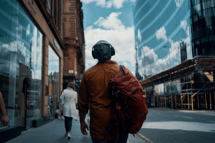 Commuter walking down busy street