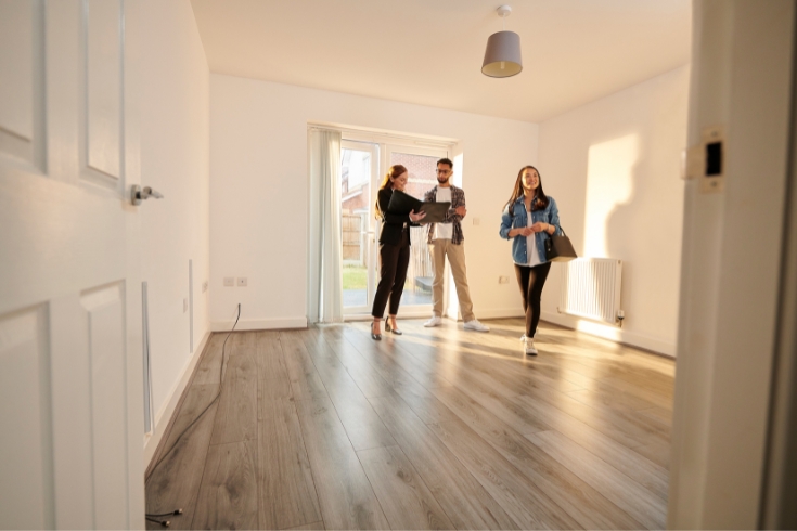 Real estate agent showround for a couple.
