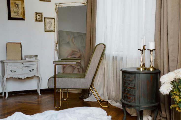 Antique and vintage furniture in a white bedroom