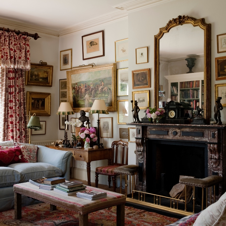 Country Estate vintage style living room with gilded mirror on fire mantle.