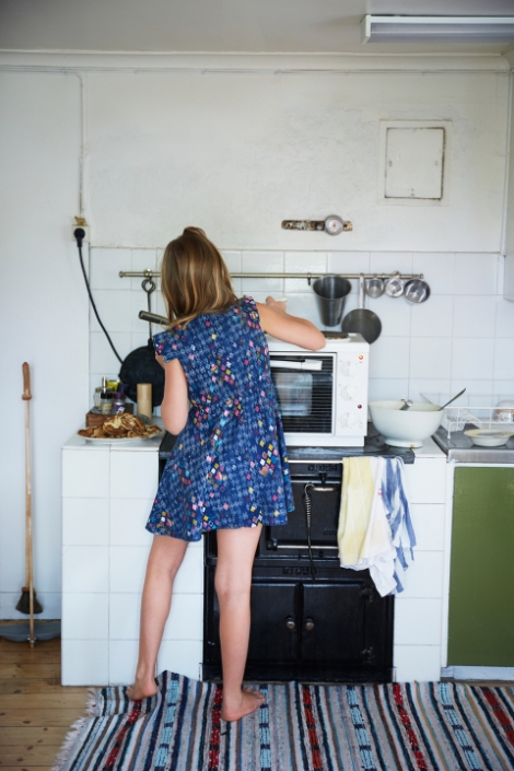 young woman cooking in kitchen