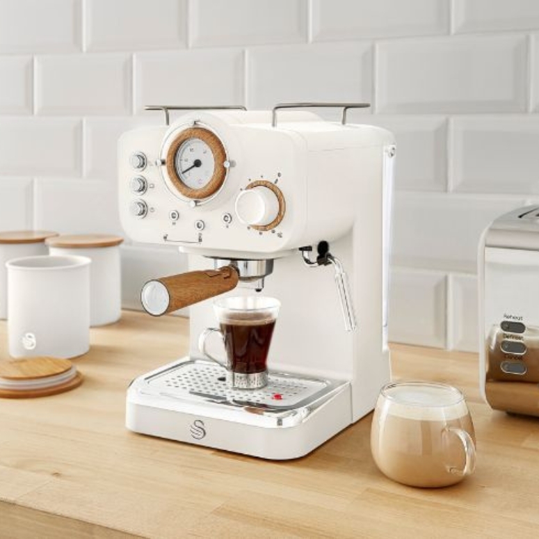 Cream colour coffee maker with espresso shot.