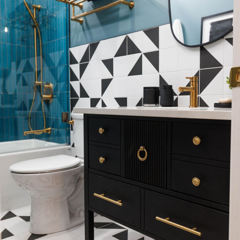 Abstract tile in blue bathroom with dark brown vanity