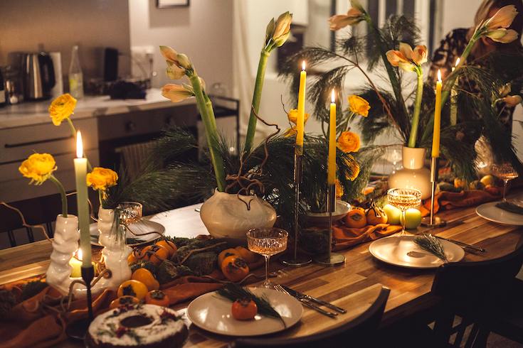 Wax Candles and Flowers on Table