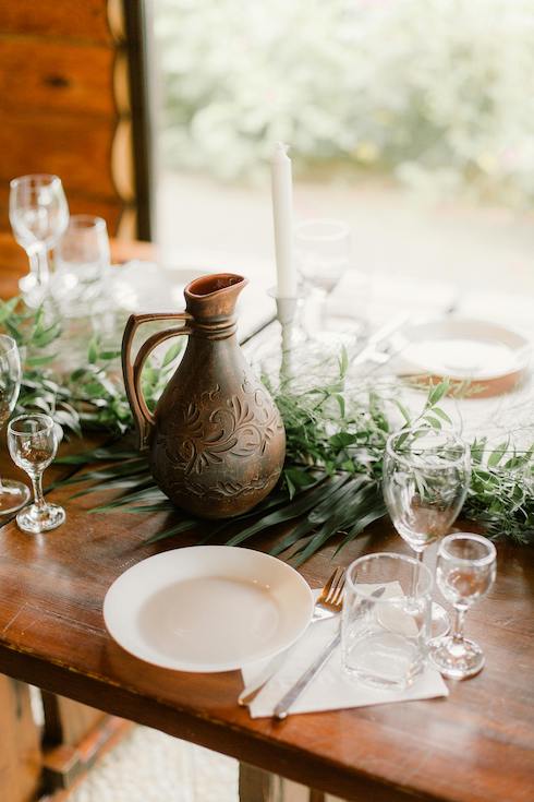Served table with jug and dish ware