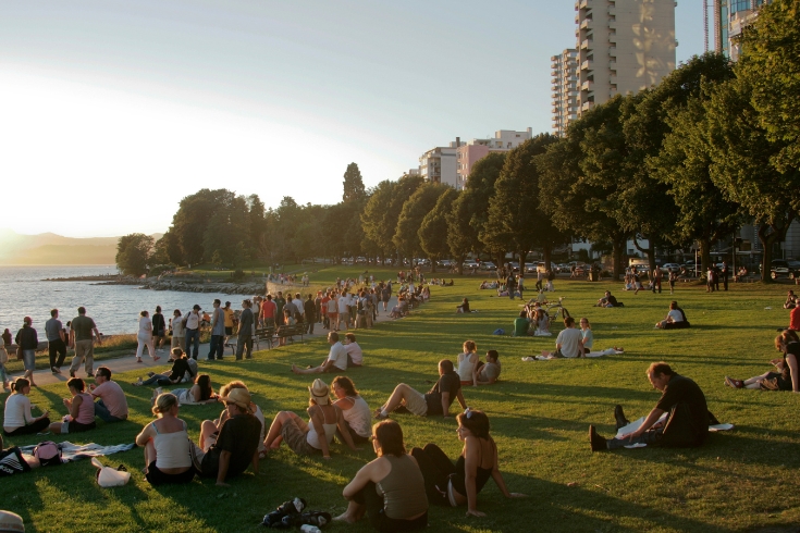 Crowd at English Bay Beach, Vancouver at sunset.