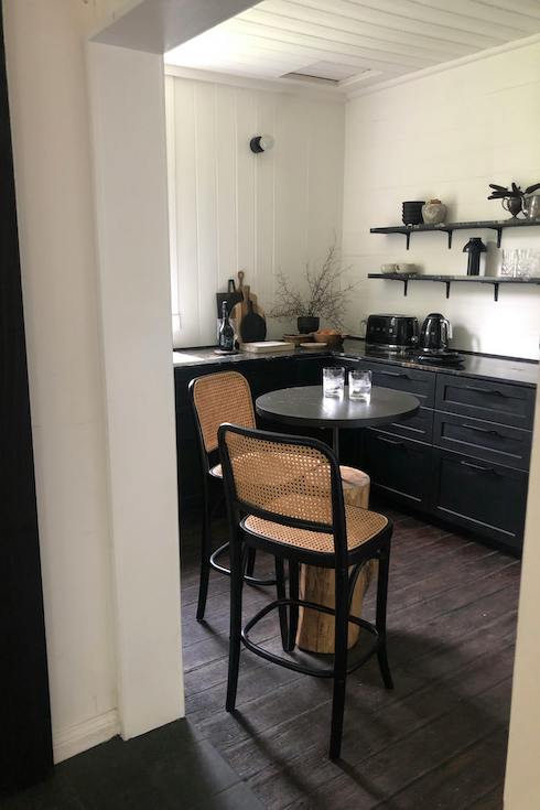 Black Wooden Table and Chairs in a modern kitchen at part of Home Network's Breakfast Nook post