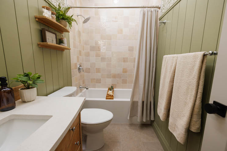 Bathroom with green shiplap and custom finishes