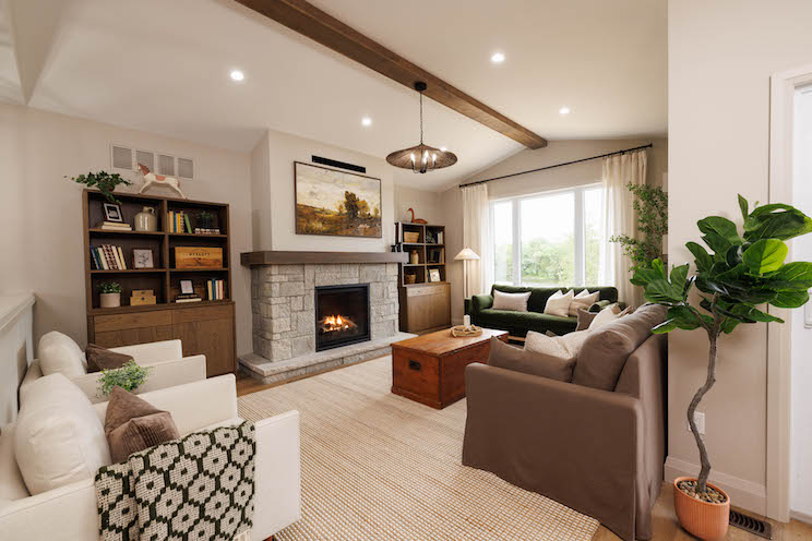 Grand room with fireplace and hidden TV in the Renovation Resort winners' cabin