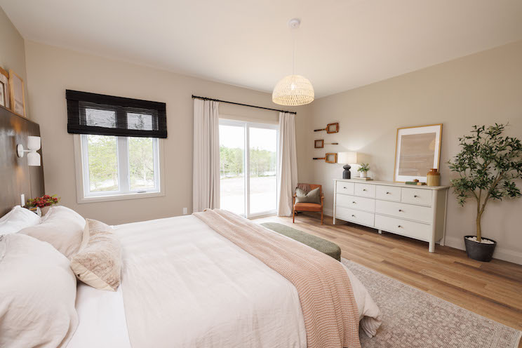 Primary bedroom with creams and pinks