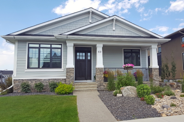 ront view of new 21st century Craftsman shingle style Bungalow. 