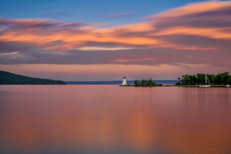 Sunset over the Kidston Island Lighthouse on Kidston Island, located in the Bras d'Or Lake in Baddeck, Nova Scotia.