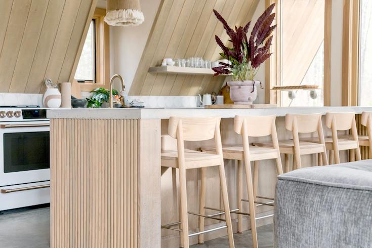 White oak siding, walls and stools stand out in this stylish kitchen as part of HOME Network's Cashmere Kitchen post