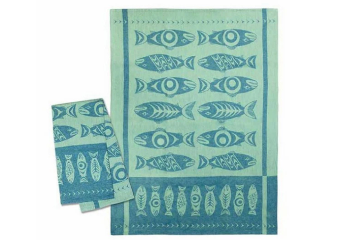 A blue and green tea towel with a fish print
