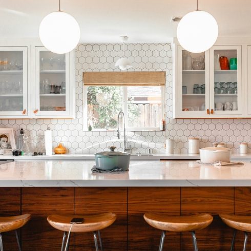 Add Side Panneling Four brown stools in modern kitchen with white counter