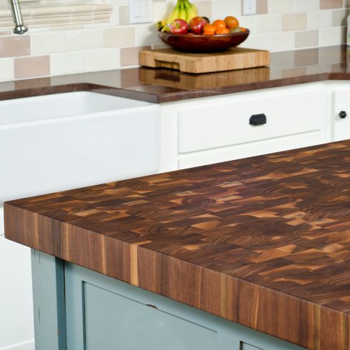 Take It to the Top Close up of wooden kitchen island counter in modern kitchen.