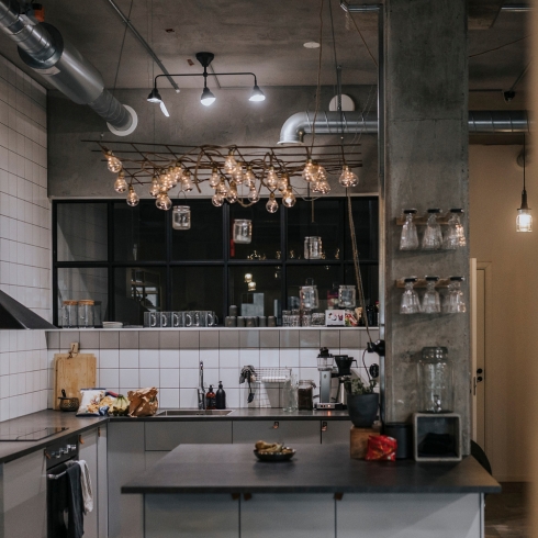 Incorporate Interesting Lighting Interior of modern, industrial kitchen with ambient lighting.