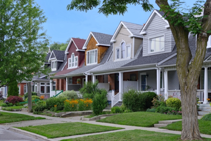 Residential street with small semi-detached houses with gable dormer windows