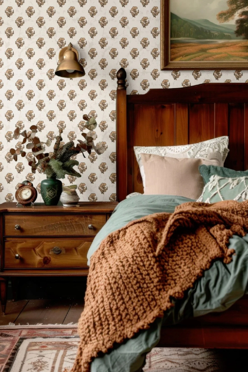 A close-up shot of a vintage white and red floral wallpaper in a bedroom