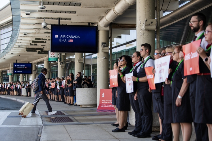  August 11: Several hundred Air Canada flight attendants demonstrate outside of Pearson international airport ahead of a potential strike. 