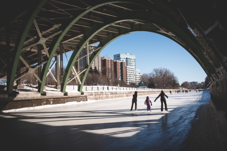 A family skating on the ice in Ottawa.