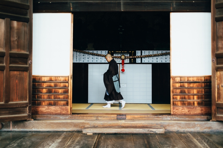 A Japanese monk is on errand and walking at the Chion-ji Temple in Kyoto Japan. 